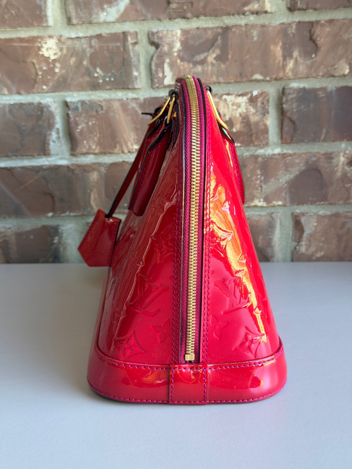 Louis Vuitton Alma Handbag Monogram Vernis PM Raspberry 57283